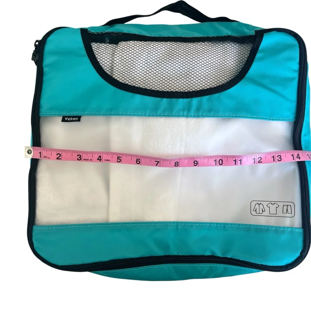 NWOT Teal and Clear Packing Cubes - Set of 4